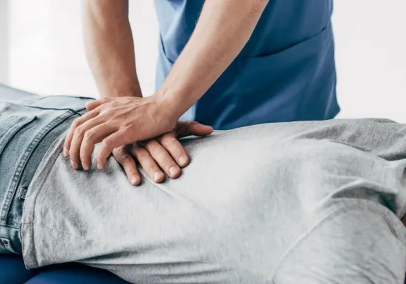 Clinician performing hands-on manual therapy and joint mobilization